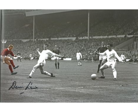 Denis Law signed 12x8 colourised photo pictured in action for Manchester United. Denis Law CBE (born 24 February 1940) is a S