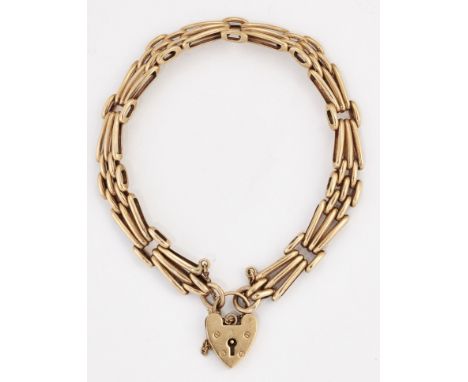 A 9 CARAT GOLD GATE LINK BRACELET, fancy angled brick links, to a 9 carat gold padlock clasp, hallmarked Birmingham 1978. Len