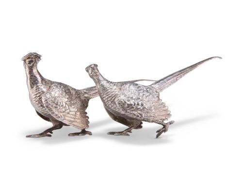 TWO SMALL SILVER COCK PHEASANTS,&nbsp;the first bird with maker's mark 'LAG', London 1958, realistically cast in a walking po