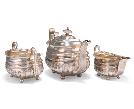 A GEORGE III SILVER THREE-PIECE TEA SERVICE,&nbsp;by Solomon Hougham,&nbsp;London 1812, comprising teapot, two-handled sugar 