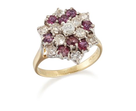 AN 18 CARAT GOLD RUBY AND DIAMOND CLUSTER RING, the tiered hexagonal head set with round-cut rubies and round brilliant-cut d