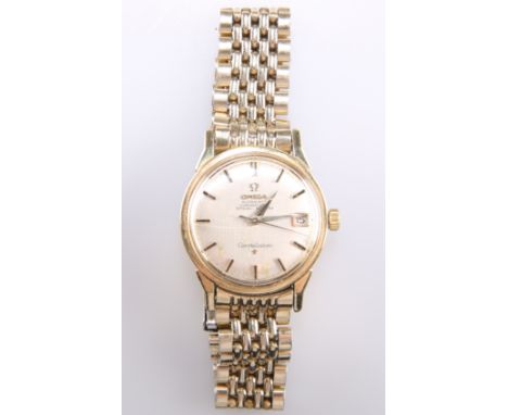AN OMEGA CONSTELLATION BRACELET WATCH,&nbsp;circular silver dial with black and gilt baton index, black and silver sword hand