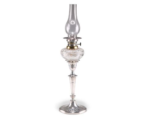 A GEORGE V SILVER CANDLESTICK LAMP, by Hawksworth, Eyre & Co Ltd, Sheffield 1910, oval, the tapering stem and base fluted and