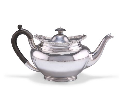 AN EDWARDIAN SILVER TEAPOT,&nbsp;by Richard Martin and Ebenezer Hall, Sheffield 1906, shaped oval, the domed hinged cover set