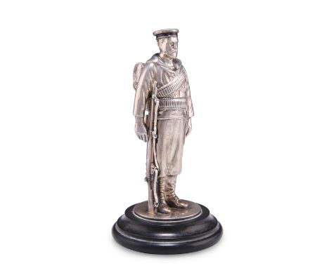 A VICTORIAN NOVELTY SILVER INKWELL, by Horace Woodward & Co Ltd, London 1898, realistically modelled as a soldier with enamel