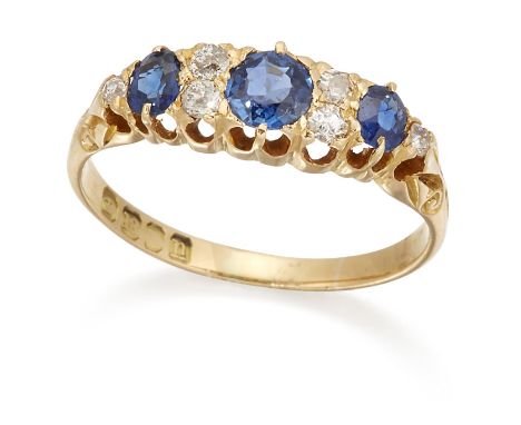 AN 18 CARAT GOLD SAPPHIRE AND DIAMOND CLUSTER RING, graduated round and oval-cut sapphires spaced by old-cut diamonds, to car