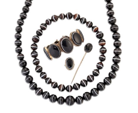 A GROUP OF VICTORIAN BANDED AGATE JEWELLERY, comprising:&nbsp;A NECKLACE OF SLIGHTLY GRADUATED BEADS, length 61.5cm; ANOTHER 