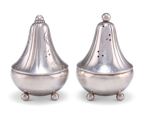 A PAIR OF DANISH SILVER SALT AND PEPPERS, by Harald Nielsen for Georg Jensen, import mark 1959, circular planished bases rais