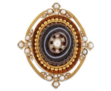 A VICTORIAN AGATE AND SPLIT PEARL BROOCH, a carved oval banded agate inset with a split pearl and diamonds, within a frame se