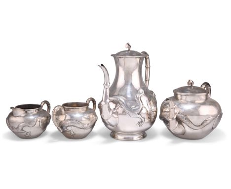 A CHINESE SILVER FOUR-PIECE TEA SERVICE, comprising teapot, coffee pot, cream jug and two-handled sugar bowl, each repousse w