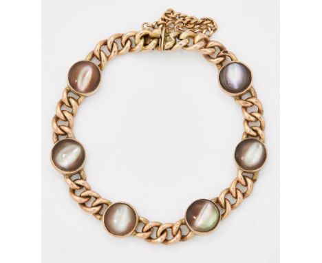 A MOTHER-OF-PEARL BRACELET, circular links inset with mother-of-pearl and spaced by curb links, marked '9CT'. Length 18.5cm, 