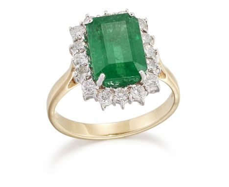 AN 18 CARAT GOLD EMERALD AND DIAMOND CLUSTER RING, an octagonal-cut emerald within a border of round brilliant-cut diamonds, 