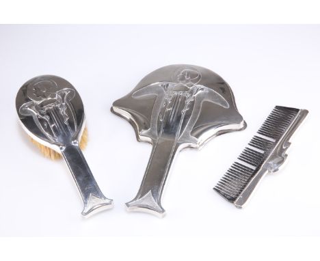 AN EDWARDIAN SILVER DRESSING TABLE SET,&nbsp;by Kate Harris for William Hutton &amp; Sons, London 1903 and 1904, chased in th