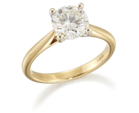 AN 18 CARAT GOLD SOLITAIRE DIAMOND RING, a round brilliant-cut diamond in a claw setting, to knife-edge shoulders, estimated 