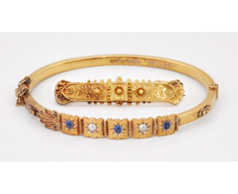 A LATE VICTORIAN 15 CARAT GOLD SAPPHIRE AND DIAMOND BANGLE, alternating round-cut sapphires and old-cut diamonds star set wit