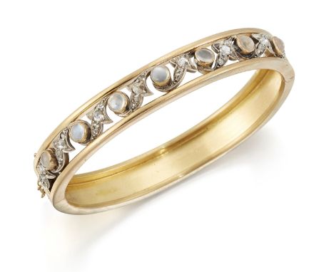A LATE 19TH CENTURY MOONSTONE AND DIAMOND BANGLE, the pieced front with round moonstones spaced by rose-cut diamond set leave