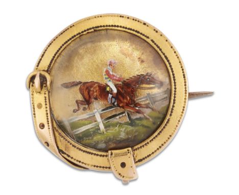 A 19TH CENTURY REVERSE INTAGLIO STEEPLECHASE BROOCH, the circular rock crystal intaglio painted depicting a horse and jockey 