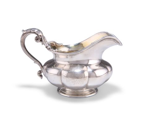 A WILLIAM IV SILVER CREAM JUG,&nbsp;by&nbsp;Paul Storr, London 1835, of squat lobed form with reeded rim, the S-scroll handle