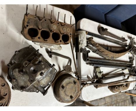 A large selection of mostly Austin Seven spares including a gearbox, engine block, carburettor, steering columns, springs etc