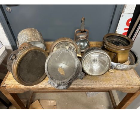 A box containing acetylene lamps, a seach lamp, car road lamps etc. 