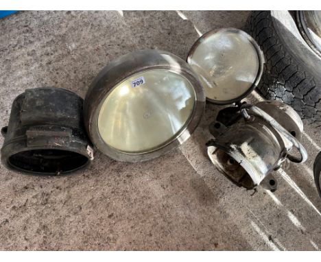 Four early headlamps including a Lucas King of The Road bell lamp. 