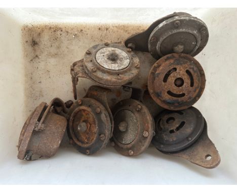Seven vintage car horns. 