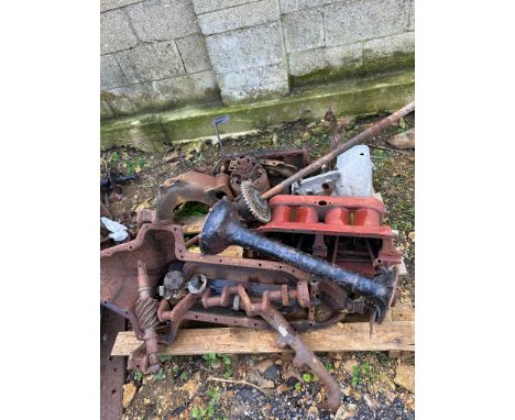 A pallet of Ford Model T engine and transmission parts. 