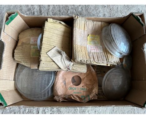 A box of assorted car lamp lenses/glasses, some in original packaging inc. Lucas etc.