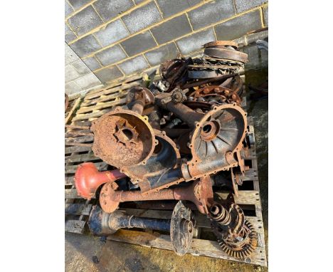 Two pallets of transmission and generator parts for a Ford Model T. 