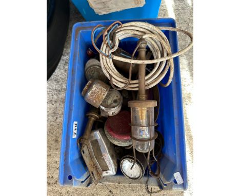 An autojumbler's lot of dashboard gauges, an early lead lamp etc. 