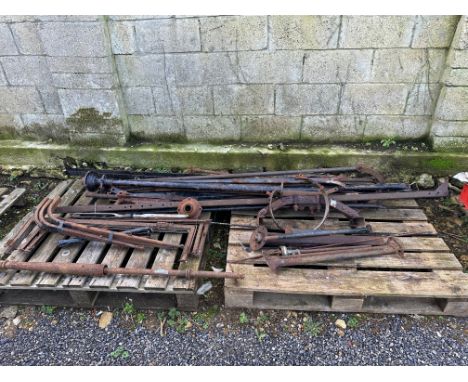 Two pallets of Ford Model T chassis rails, dry shafts, steering columns etc. 
