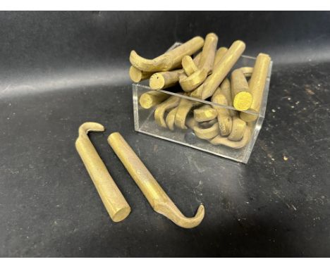A box of Bugatti fixings and bonnet catch castings. 