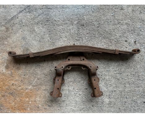 A vintage car leaf spring and bracket. 