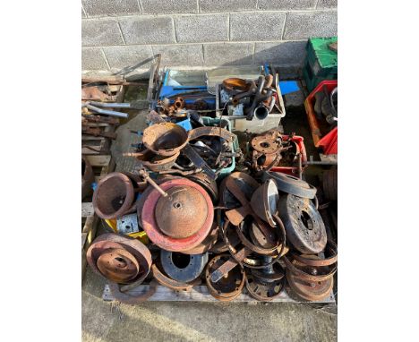 Two pallets of Ford Model T parts including windscreens, handbrake drums etc. 