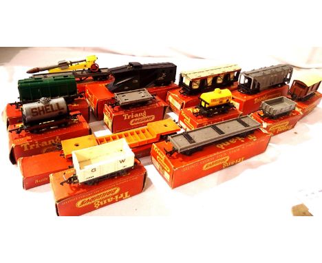 Thirteen Triang OO wagons, includes rocket launcher, pickle truck, snowplough etc, mostly in very good condition, boxes fair.