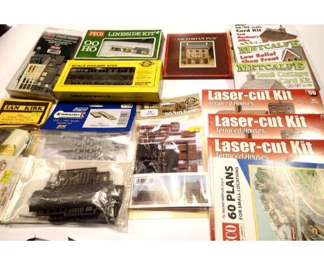 Collection of plastic and card OO scale railway related kits; bus, coach, cottage, shop, houses etc and a Plans book for smal