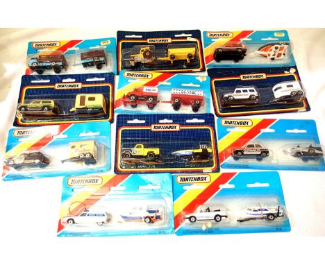 Eleven Matchbox twin sets of vehicles with trailers, all in excellent condition/blister packs. P&amp;P Group 1 (£14+VAT for t