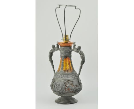Art Nouveau pewter and Cranberry Glass twin handled lamp, decorated with classical figure handles with stylised floral decora