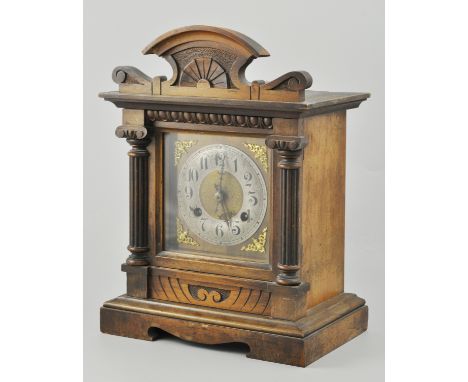 Continental beech shelf clock, striking movement, cast dial, 35cm.