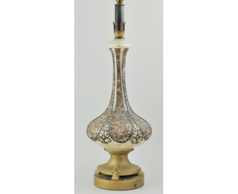 Table lamp, metal fitments, glass vase-shaped column, floral decoration and applied pewter beading, 69cms overall.