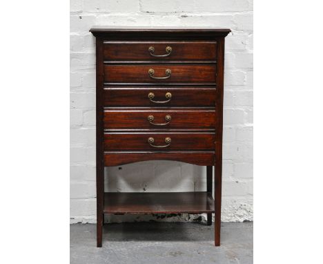 Edwardian mahogany music cabinet, fitted with five flat-front drawers, over an open shelf, 53cms.