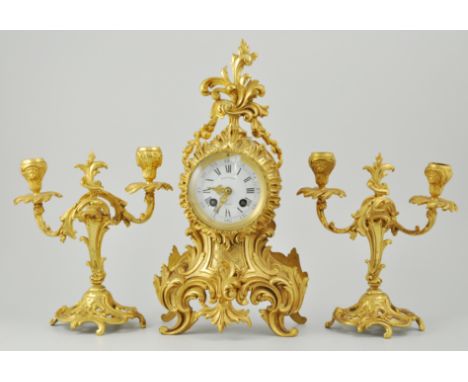French ormolu clock and garniture set, white enamel dial with Roman numerals, dial signed Faucher. Height 39cms.