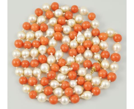 Coral and seed pearl necklace, spherical coral beads, interspersed with seed pearls, finished with a yellow metal clasp, mark