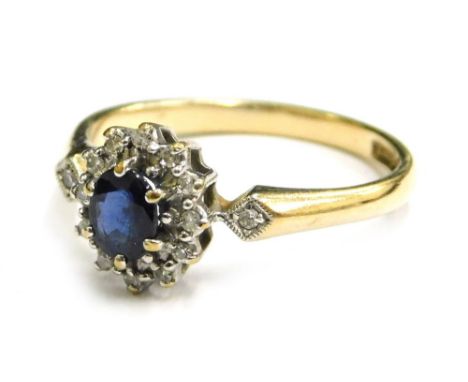 A 9ct gold cluster ring, the central cluster set with white and blue stone, each in claw setting with tiny diamond set should