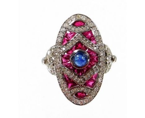 An Art Deco style ruby, diamond and sapphire cocktail ring, with arrangement of baguette cut rubies and round brilliant cut d