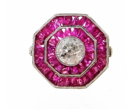 An octagonal ruby and diamond ring, with central round brilliant cut diamond, in rub over setting, 5.8mm x 5.8mm x 4mm, appro