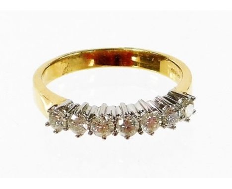 An 18ct gold half hoop diamond eternity ring, set with seven round brilliant cut diamonds, each in claw setting, 2.4mm x 2.4m