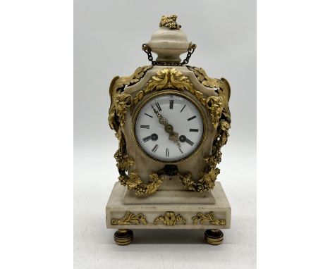 A French alabaster and ormolu mantle clock on bun feet (one part loose but present)