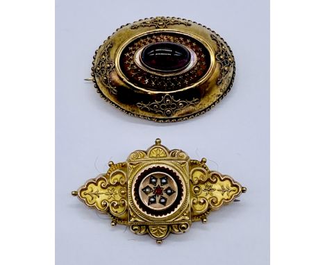 Two yellow metal mourning brooches (both test as 9ct) the larger with cabochon garnet, the other with a ruby and seed pearls-