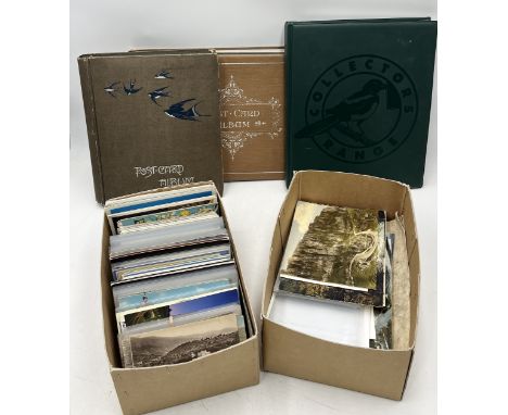 A large collection of vintage postcards including three partially completed albums 